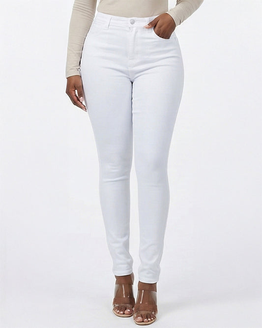 Detail view of white skinny jeans showing front pocket and stitching