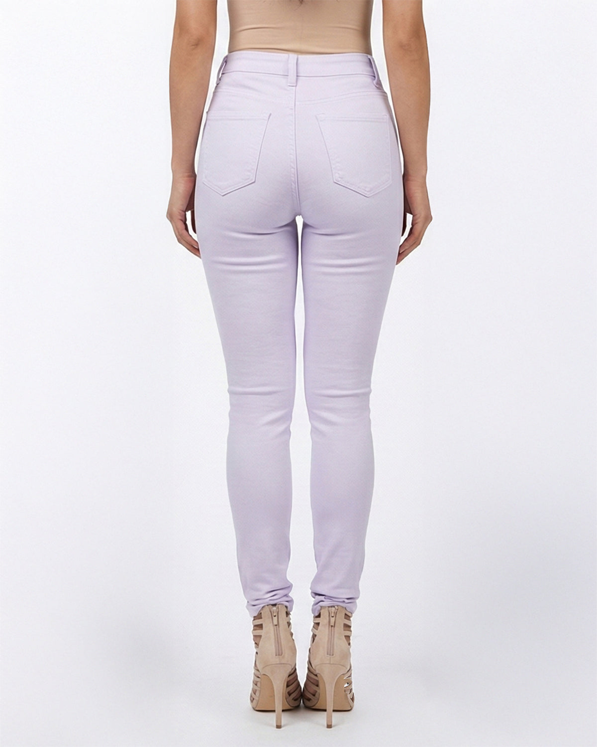 Back view of light purple stretch skinny jeans on a model