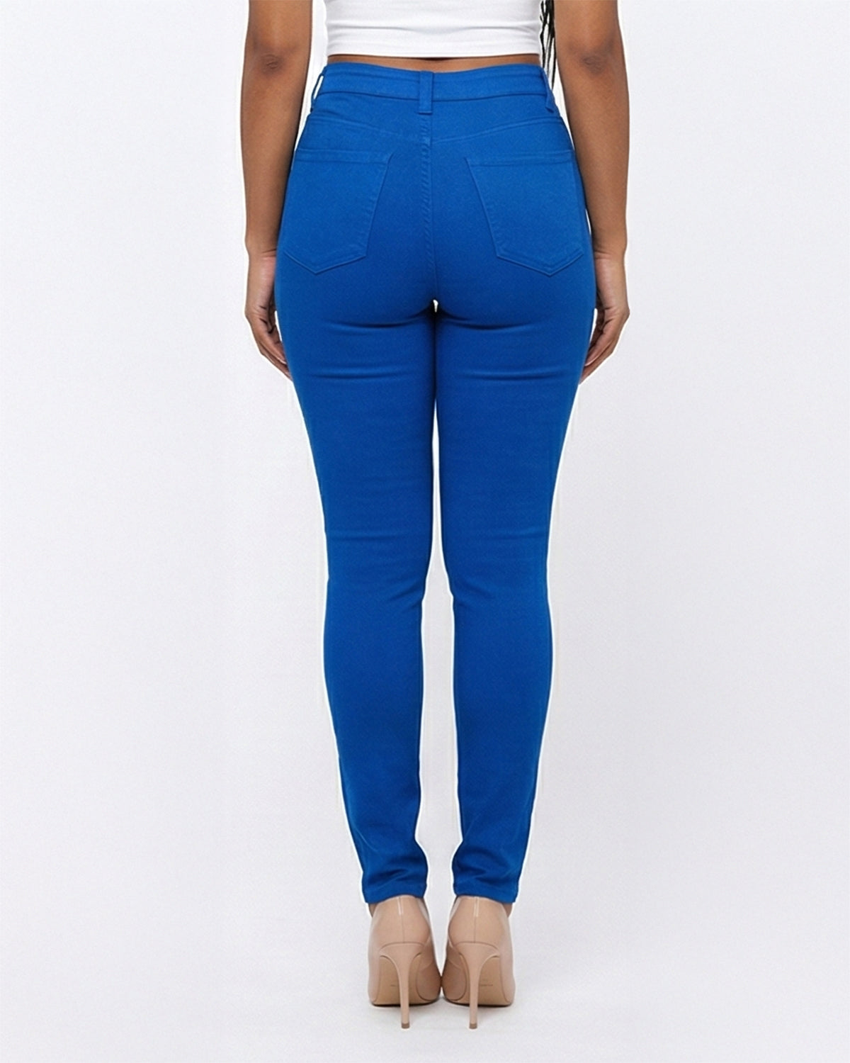 Back view of blue stretch skinny jeans on a model