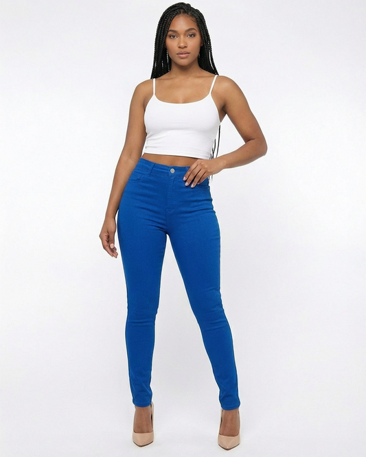 Woman wearing blue jeans and a white tank top on a white background