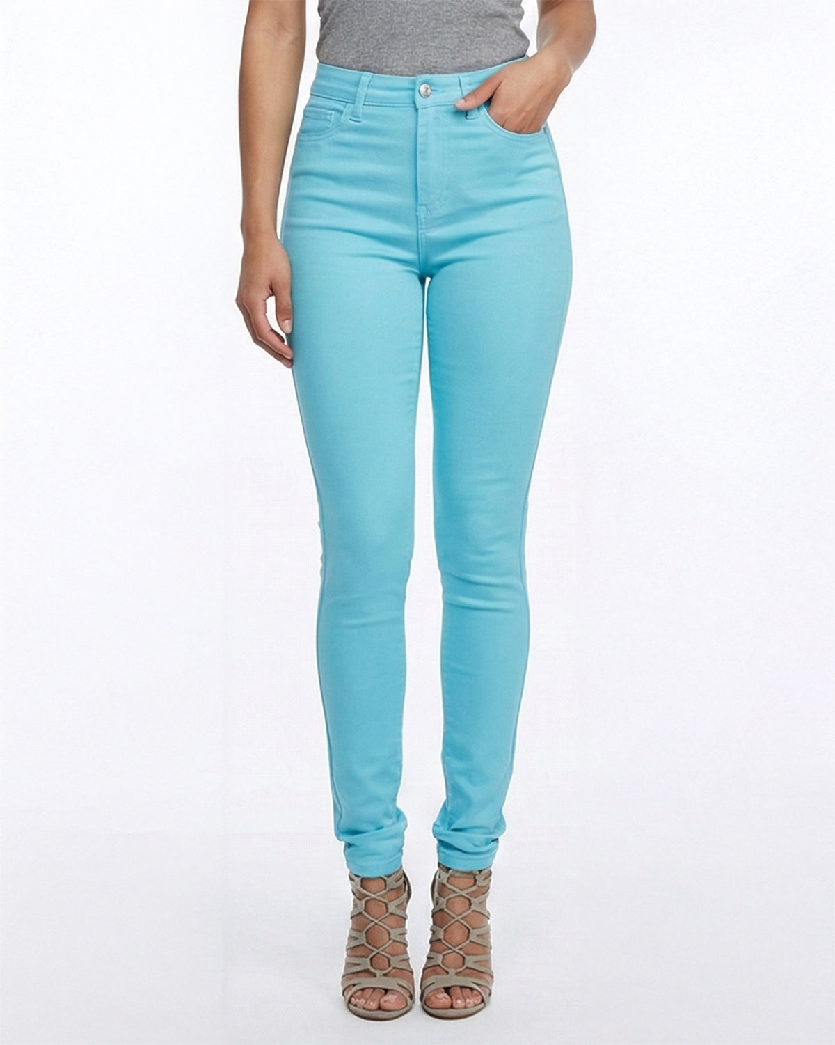 Close up view of sky blue skinny jeans worn by a model showing pockets and stitching