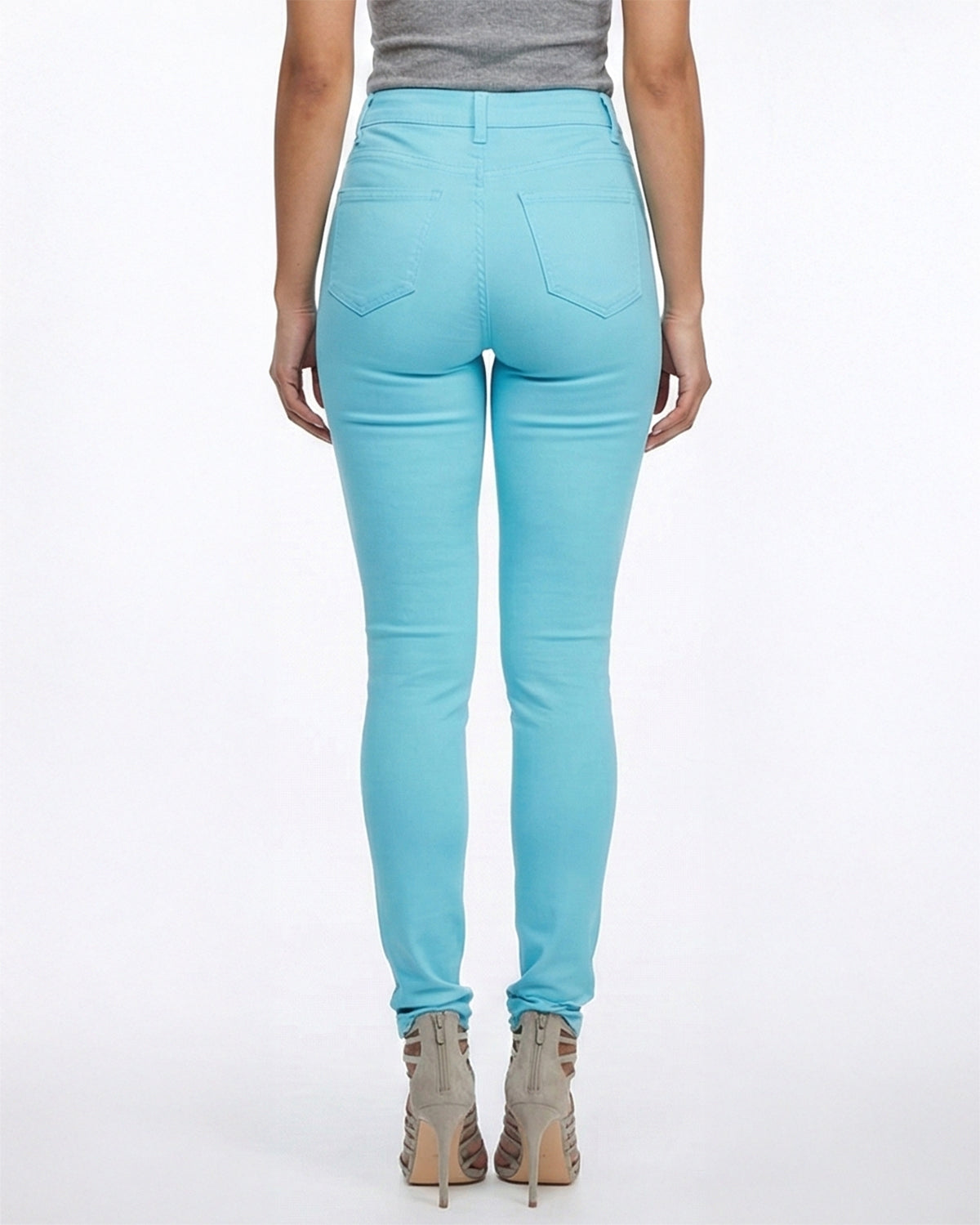 Back view of light blue stretch skinny jeans on a model
